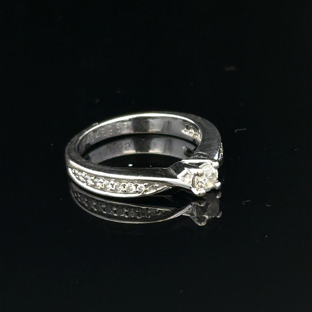 18ct white gold diamond ring with 1/3 carat total weight, size J, featuring a sparkling diamond centerpiece.