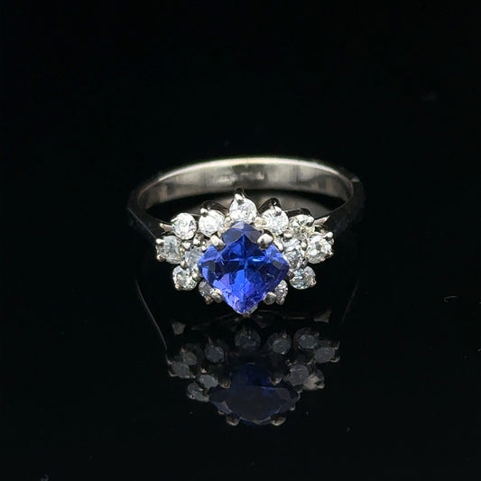 18ct white gold diamond and tanzanite ring, size O, featuring sparkling gemstones and elegant design.