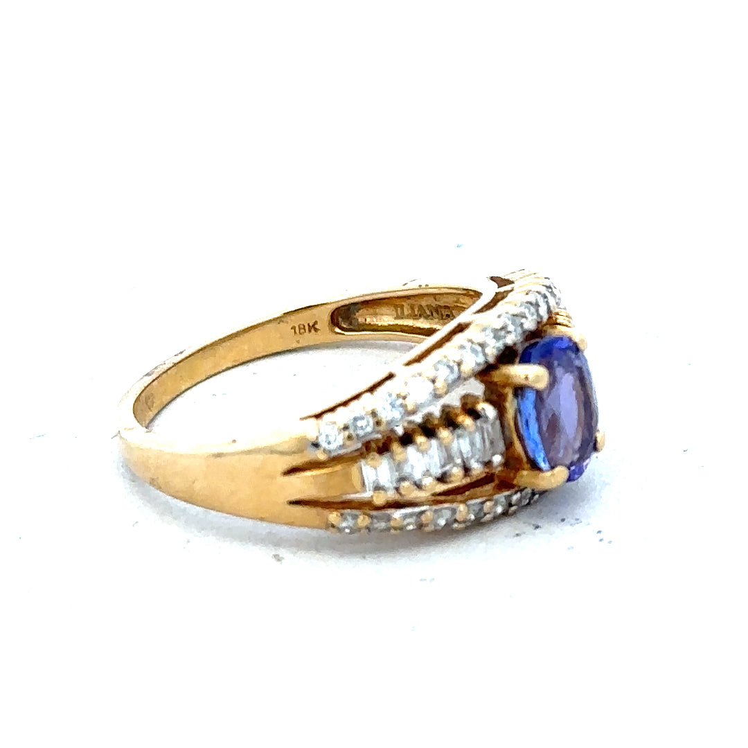 18ct yellow gold diamond and tanzanite ring, size N1/2, featuring a sparkling gemstone design.