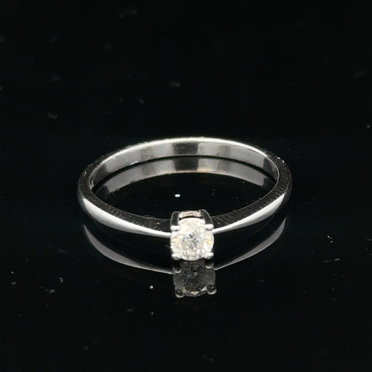 18ct white gold diamond ring with 1/4 carat solitaire, size P1/2, featuring a sparkling diamond setting.