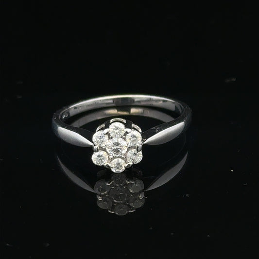 9ct white gold diamond cluster ring size O 1/2, featuring sparkling diamond accents on a polished band.