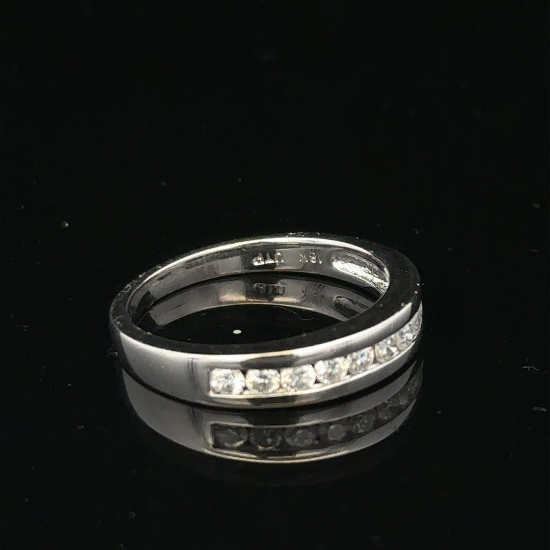 18ct white gold diamond ring in size L with sparkling diamonds, featuring a sleek and elegant design.