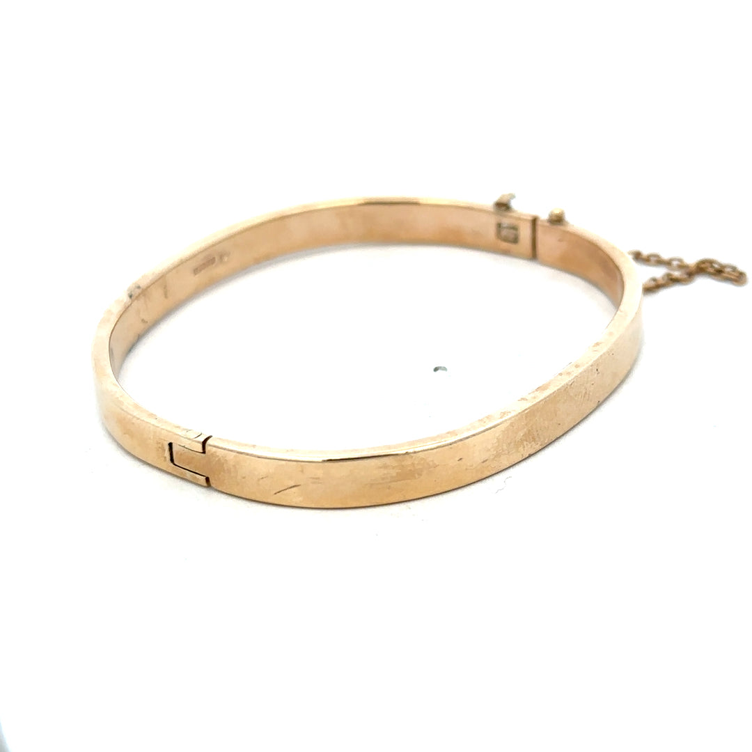 Reeves and Sons 9ct yellow gold bracelet bangle weighing 24.1g, smooth polished surface, stylish jewelry accessory