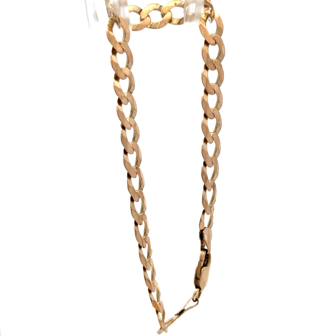 9ct yellow gold curb bracelet with intricate links, weighing 7.7g, crafted by Reeves and Sons.