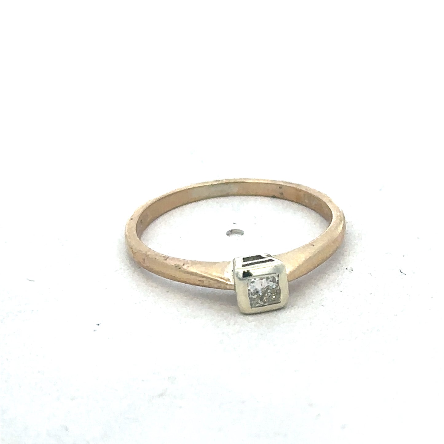 9ct yellow gold diamond ring by Reeves and Sons, featuring a sparkling diamond centerpiece and elegant band design.
