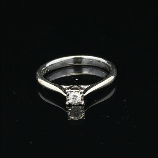 9ct white gold diamond solitaire ring by Reeves and Sons with a prominent central diamond and sleek band design.
