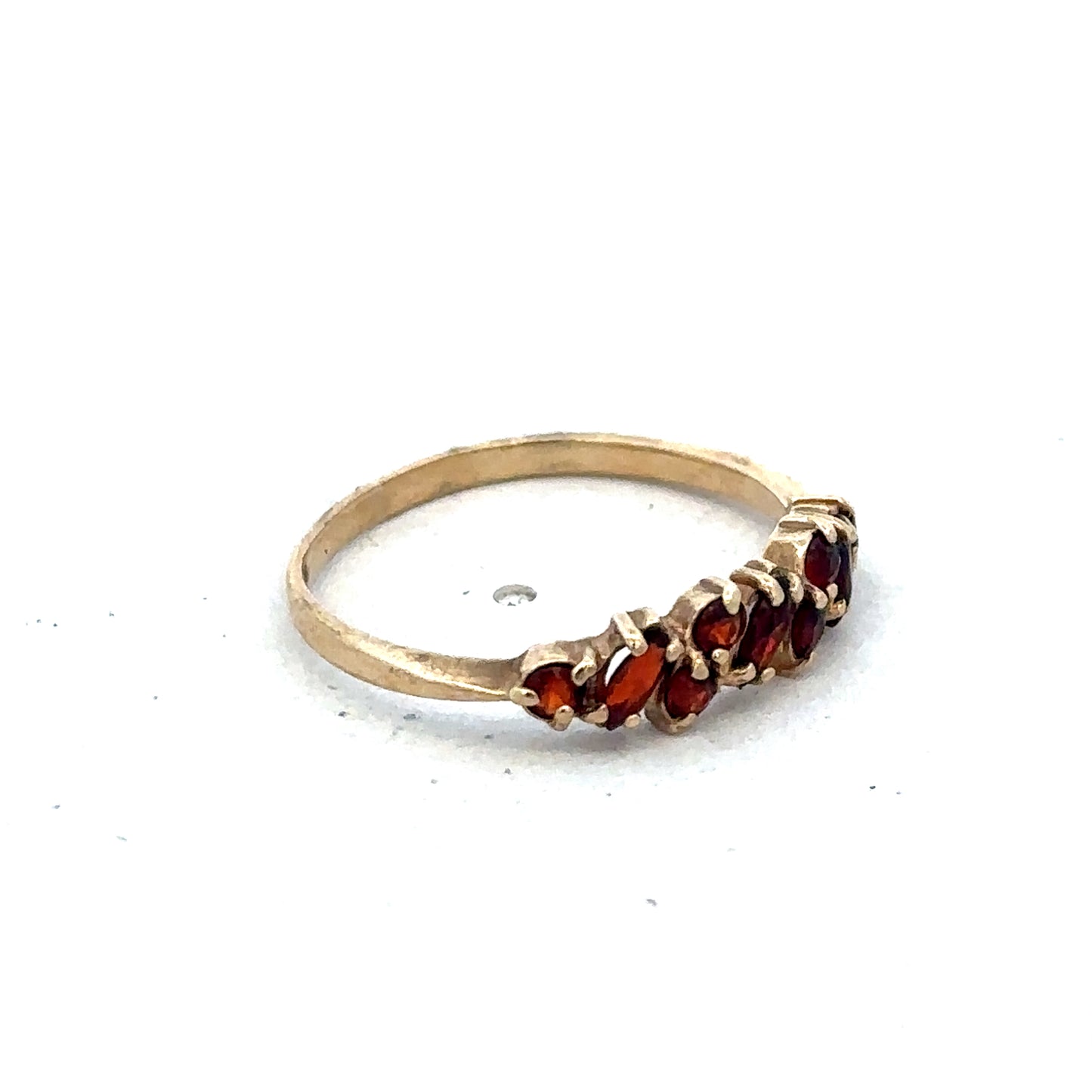 9ct yellow gold ring size N by Reeves and Sons, showcasing a smooth, polished band on a neutral background.