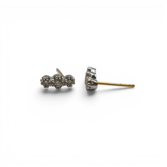 18ct yellow and white gold diamond stud earrings by Reeves and Sons, featuring sparkling diamonds in a classic setting.