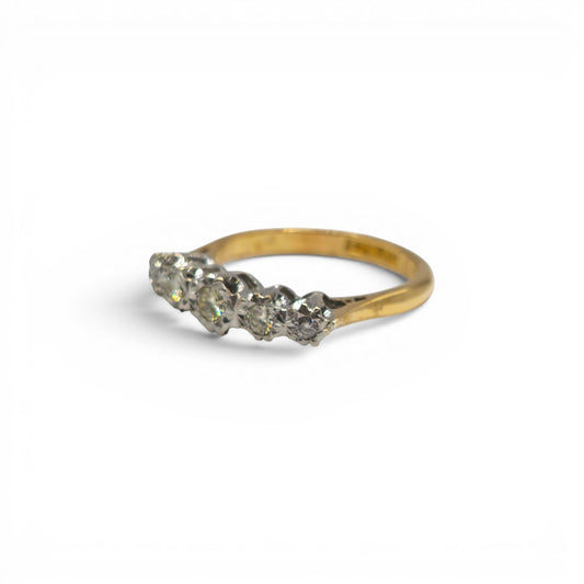 18ct yellow gold diamond ring by Reeves and Sons, featuring a sparkling diamond design, shown in close-up.