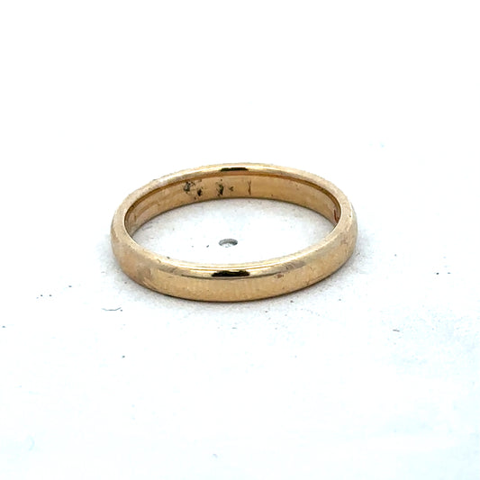 Yellow gold ring in size N by Reeves and Sons, showcasing a smooth band design with a polished finish.