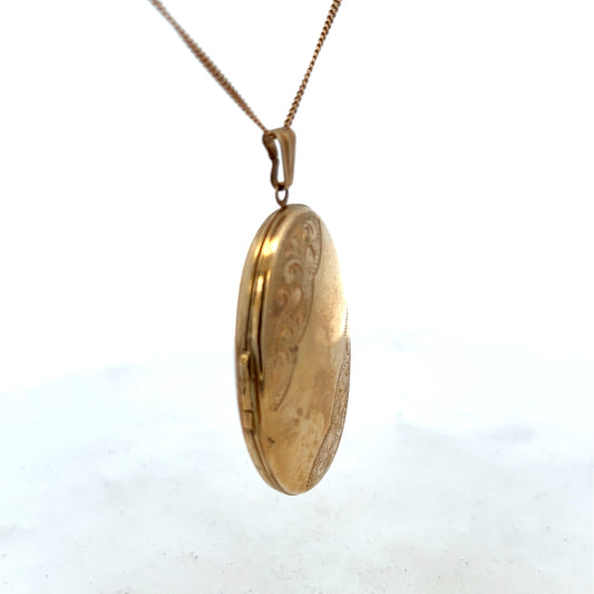9ct yellow gold locket pendant with intricate design, weighing 6.3g, by Reeves and Sons, shown with detailed craftsmanship.