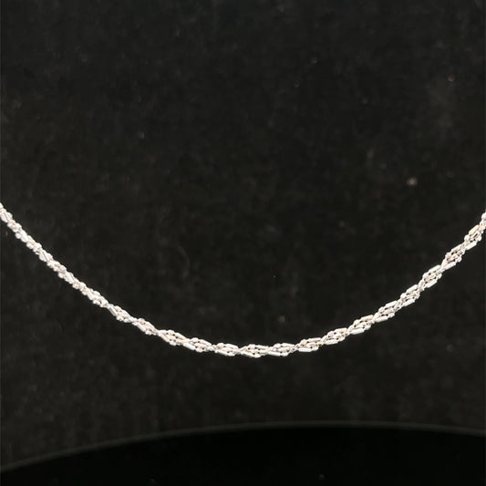 9ct white gold chain weighing 3.2g, featuring a delicate link design from Reeves and Sons, shown in the image.