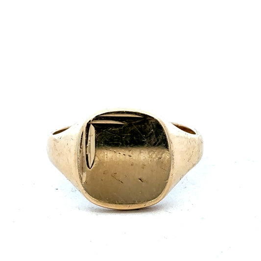9ct yellow gold signet ring in size U with engraved face, crafted by Reeves and Sons, displayed on a neutral background.