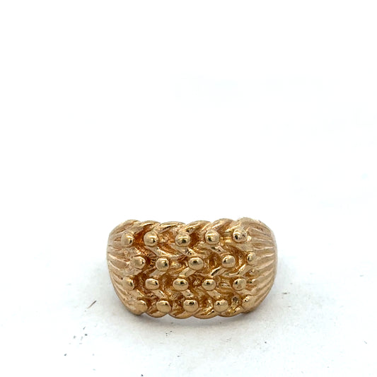 9ct yellow gold keeper ring size U by Reeves and Sons, close-up of smooth band with polished finish.