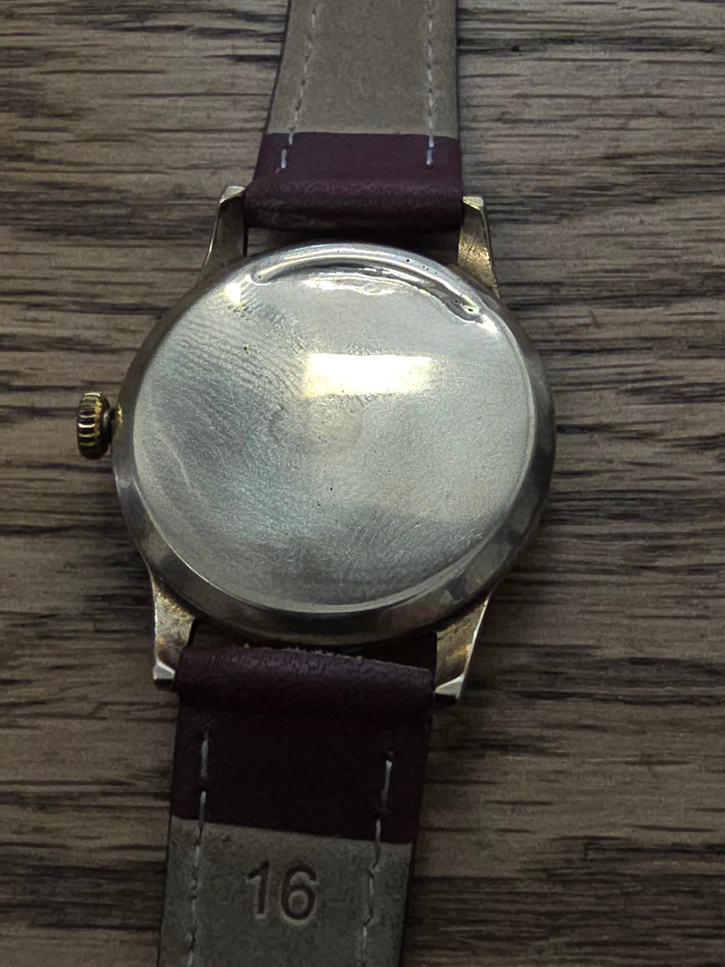 9ct yellow gold Tudor royal watch with brown leather strap, featuring a classic round dial and elegant design.