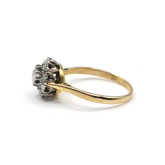 18ct gold diamond cluster ring with 0.55 carats of sparkling diamonds, featuring a stylish unbranded jewelry design.