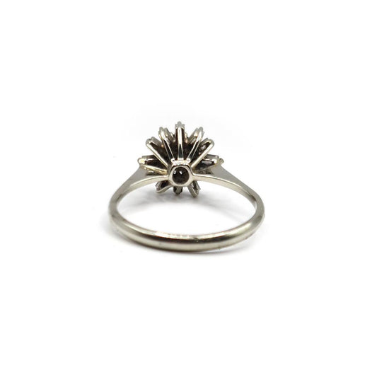 18ct white gold diamond cluster ring with 0.81 carats of sparkling diamonds, showcasing a luxurious and elegant design.
