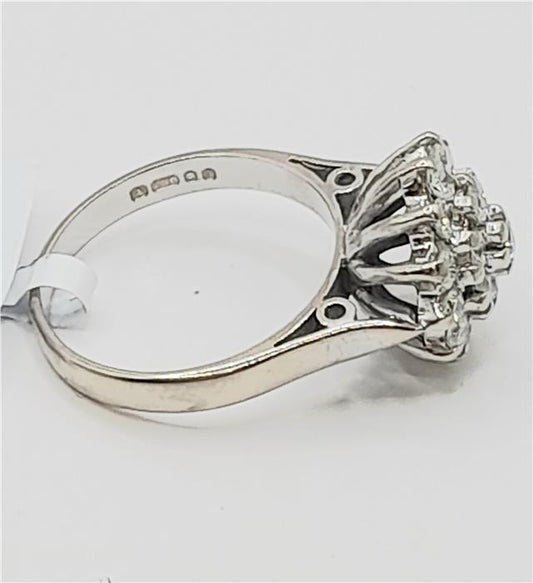 18ct white gold diamond cluster ring in size L featuring a sparkling diamond design and elegant craftsmanship.