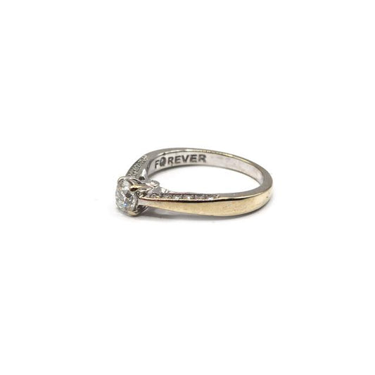18ct white gold diamond ring featuring a sparkling central diamond and elegant design, unbranded jewelry piece.