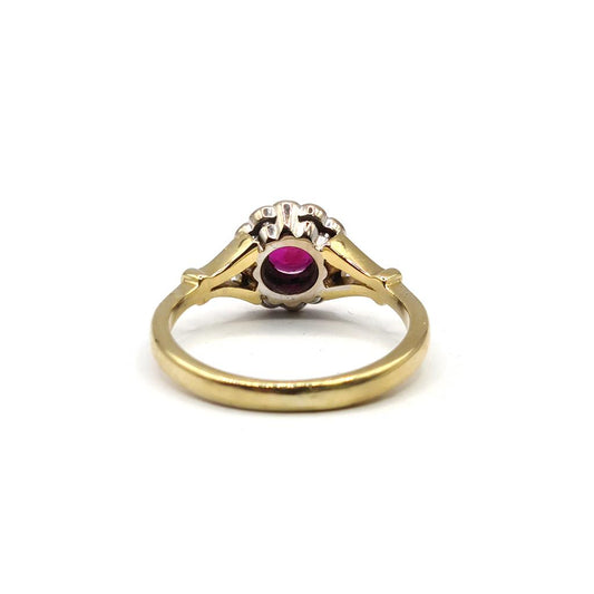 18ct yellow gold ring with 0.33 carat ruby and 1/4 carat diamond, featuring a detailed and elegant design.