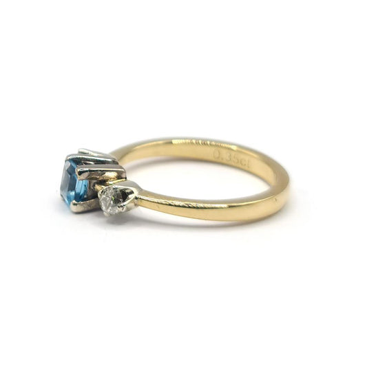 18ct yellow gold ring featuring a 0.35 carat topaz and 0.14 carat diamond accents, elegant jewelry piece.