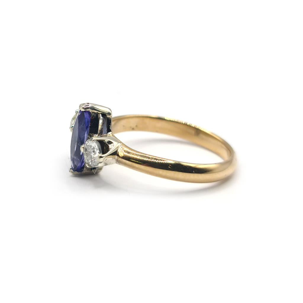 18ct yellow gold ring with a 0.50 carat tanzanite and 0.30 carat diamond accents, elegant jewelry piece.