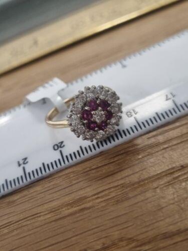 18ct yellow gold ring featuring 1.18ct diamonds and 0.36ct rubies, size K, elegant jewelry piece with gemstone accents.
