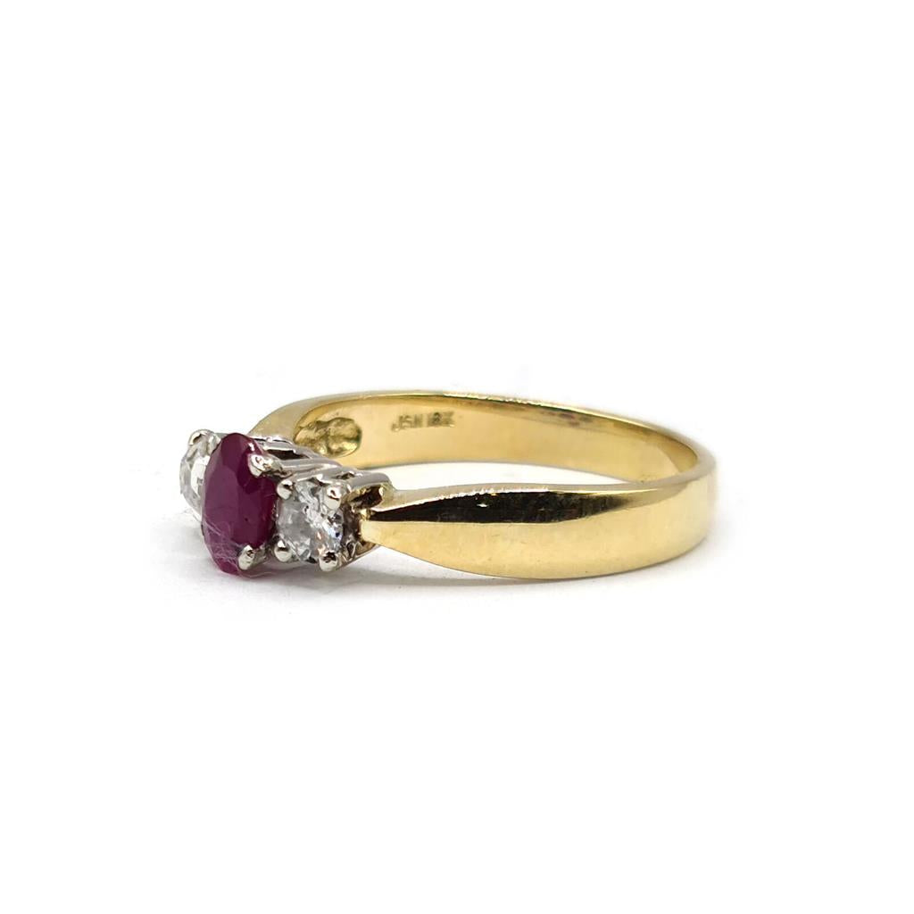 18ct yellow gold ruby and diamond ring featuring a half-carat ruby and 0.30 carat diamonds, unbranded jewelry for elegant wear.