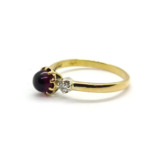 18ct yellow gold garnet and diamond ring featuring a 1.45 carat garnet and 0.30 carat diamonds, elegant jewelry piece.