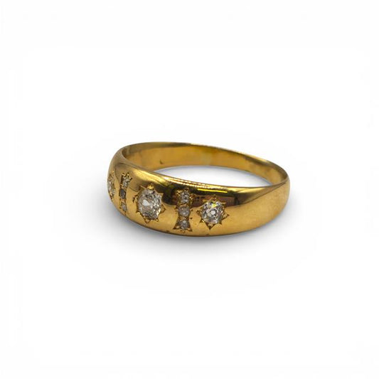 18ct yellow gold diamond ring with sparkling gemstones, showcasing a classic and elegant jewelry design.