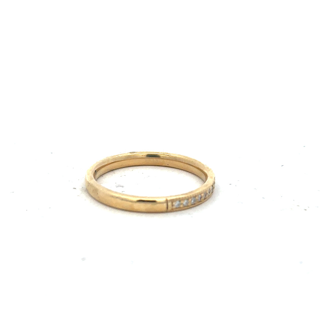 18ct yellow gold diamond ring in size P with sparkling diamonds, unbranded jewelry piece on a neutral background.