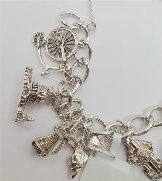 925 silver charm bracelet weighing 53.6g and 7 inches long, unbranded jewelry accessory with decorative charms and detailed craftsmanship.