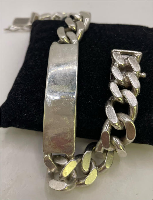 925 silver ID bracelet with engraved plate, unbranded jewelry accessory, featuring a sleek and polished design.