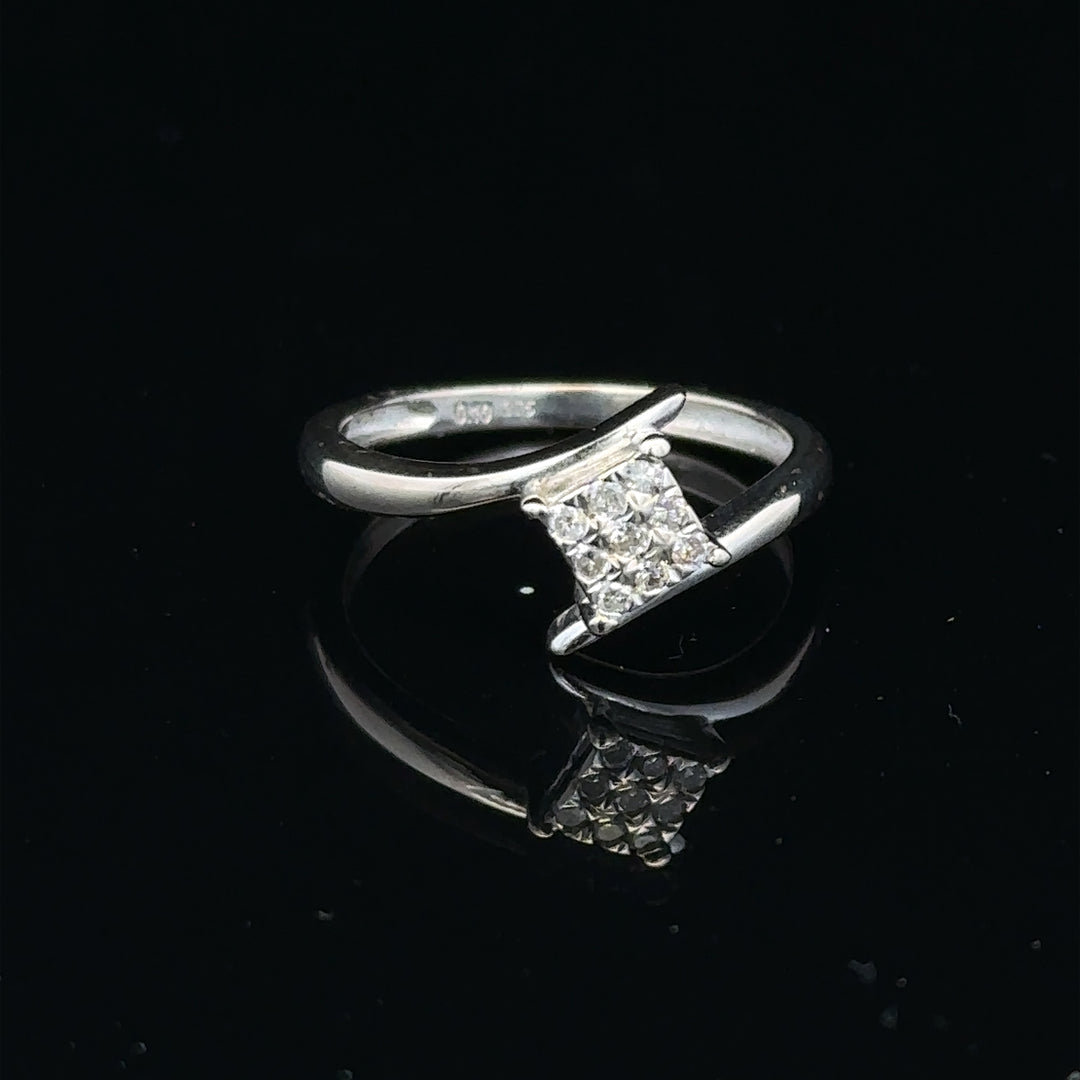 9ct white gold diamond cluster ring with a 10-point diamond, showcasing a sparkling, elegant jewelry piece.