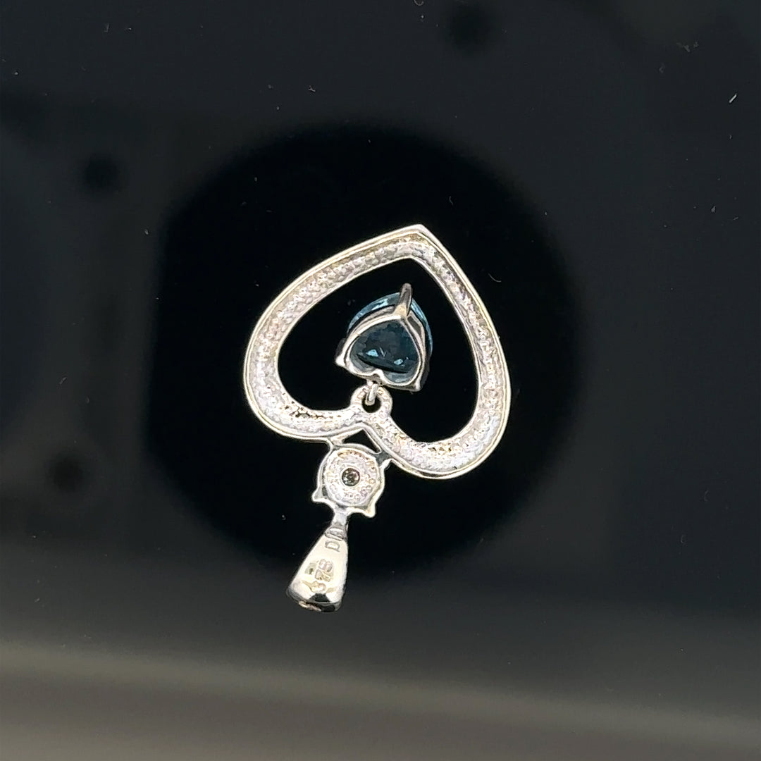 9ct white gold pendant weighing 1.2g, unbranded jewelry piece with intricate design, displayed on a neutral background.