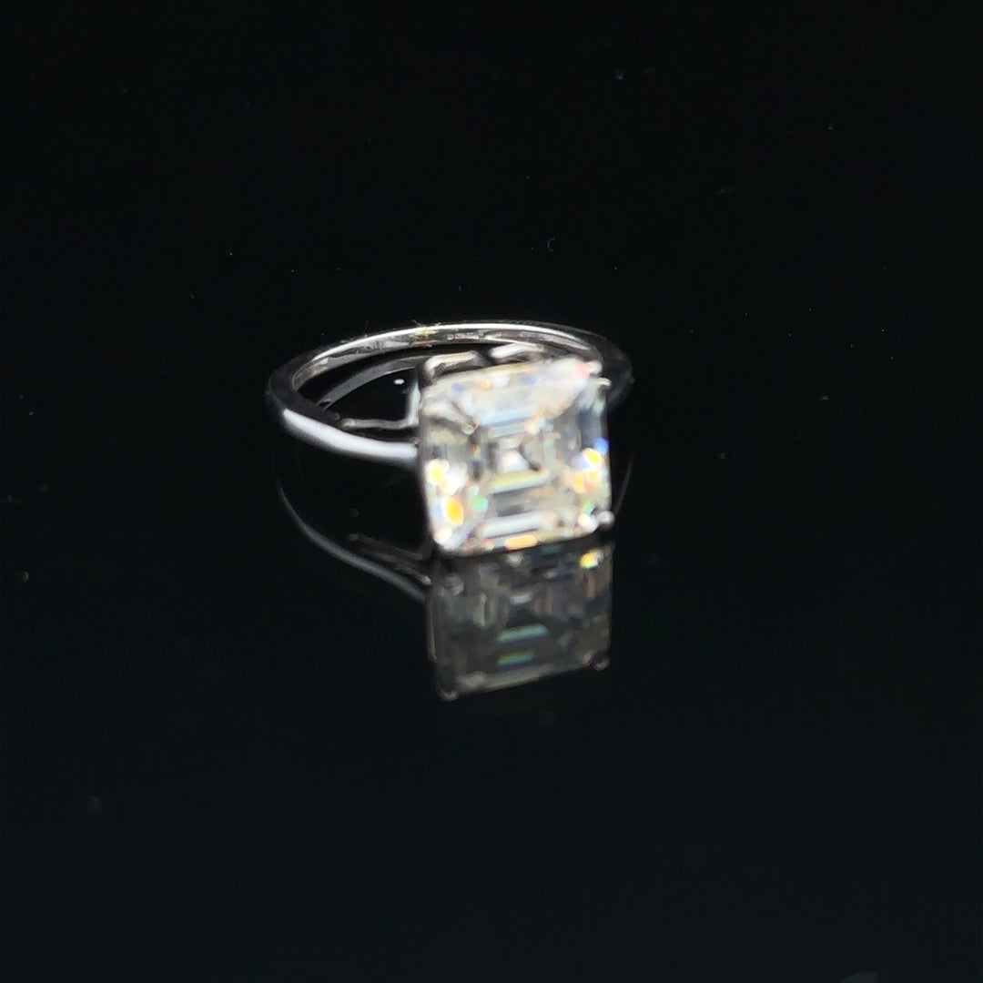 9ct white gold ring in size L with a sleek, polished finish, showcasing a elegant and timeless jewelry piece.