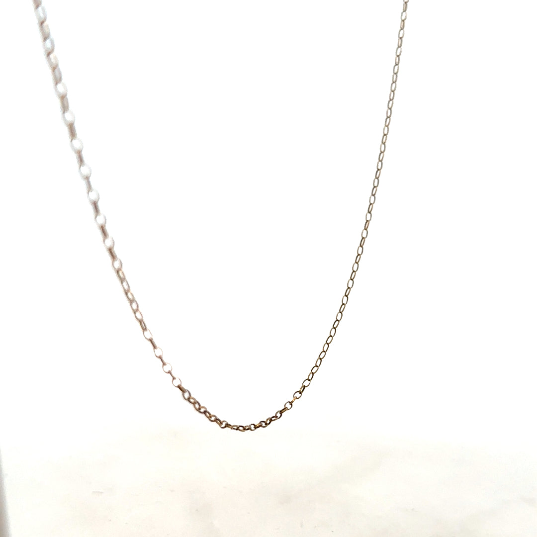 9ct yellow gold chain with a delicate design, weighing 1 gram, showcased in a close-up view highlighting its fine craftsmanship.