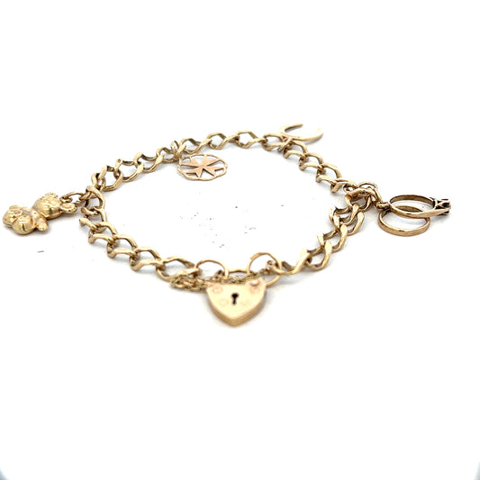 9ct yellow gold charm bracelet weighing 9.9g, unbranded, with detailed gold charms and adjustable chain.