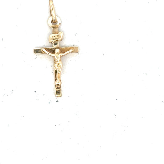 9ct yellow gold cross pendant, unbranded, weighing 1.3g, featuring a classic religious design with polished finish.