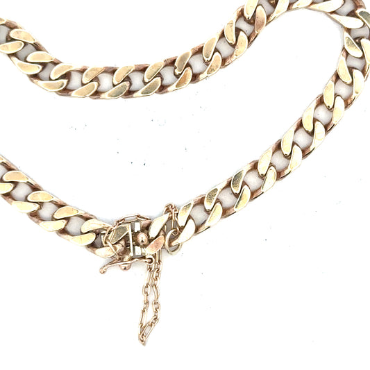 9ct yellow gold curb bracelet with 20g weight, showcasing a polished chain design on a neutral background.