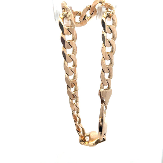 9ct yellow gold curb bracelet weighing 31.9g, featuring classic interlinked chain design, unbranded, shown in the image.