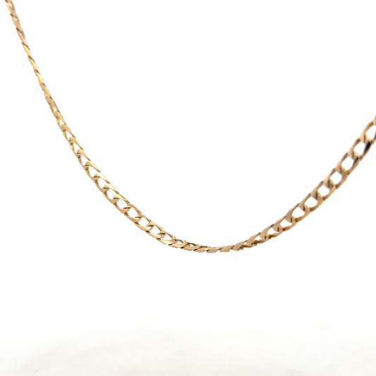 9ct yellow gold curb chain showing its detailed link design and polished finish, weighing 9.9g, unbranded jewelry accessory.