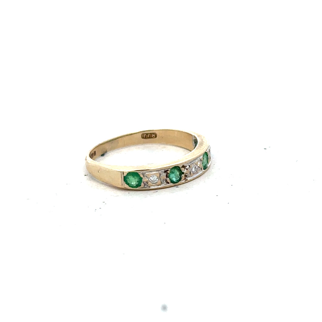 9ct yellow gold ring featuring diamonds and emeralds, size K, with intricate design and sparkling gemstones.