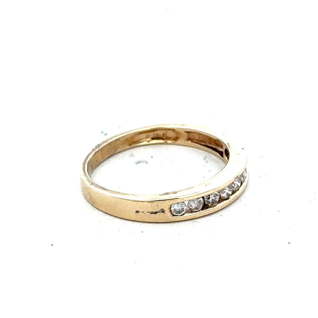 9ct yellow gold diamond ring size K 1/2 with sparkling diamonds, unbranded jewelry piece displayed on a plain background.