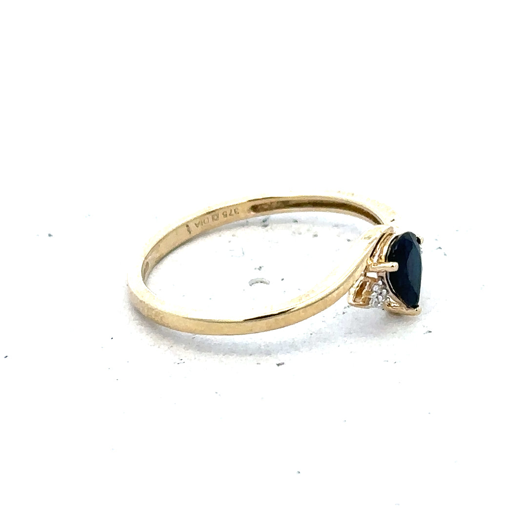 9ct yellow gold diamond ring in size P with sparkling diamonds, featuring a simple elegant design.