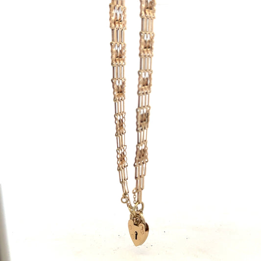 9ct yellow gold gate bracelet, unbranded, with a polished finish and adjustable clasp, weighs 5.8 grams.