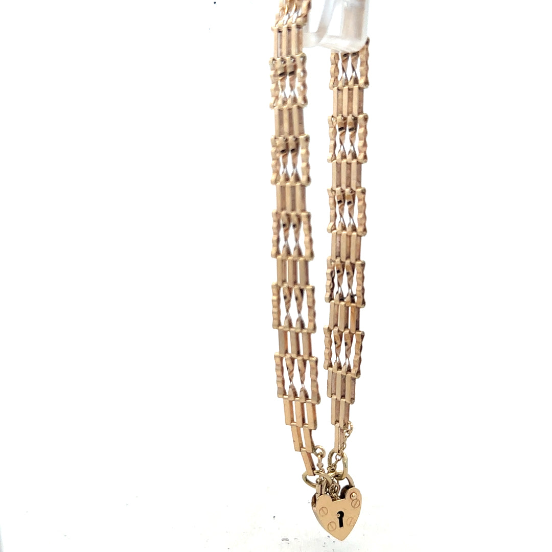 9ct yellow gold gate bracelet with a polished finish, weighing 5.8g, unbranded jewelry accessory, shown on a plain background