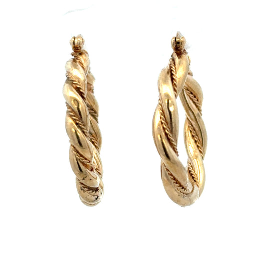 9ct yellow gold hoop earrings weighing 4.9g, featuring a classic circular design and polished finish.