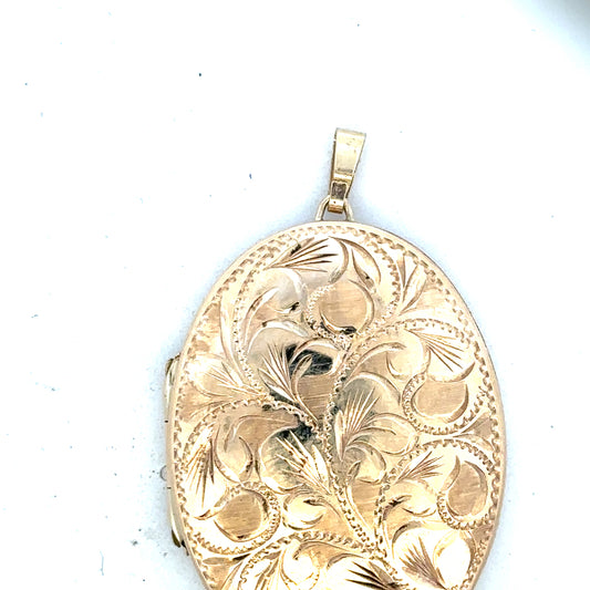 9ct yellow gold locket pendant with intricate design, weighing 13.8g, unbranded jewelry accessory displayed on a white background.