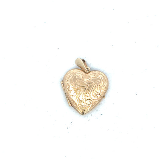 9ct yellow gold locket pendant, unbranded, weighing 2.5g, with intricate design and secure bail, suitable for personal jewelry.